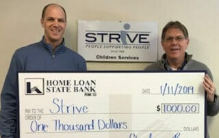 STRiVE received a check from our community partners Home Loan State Bank.